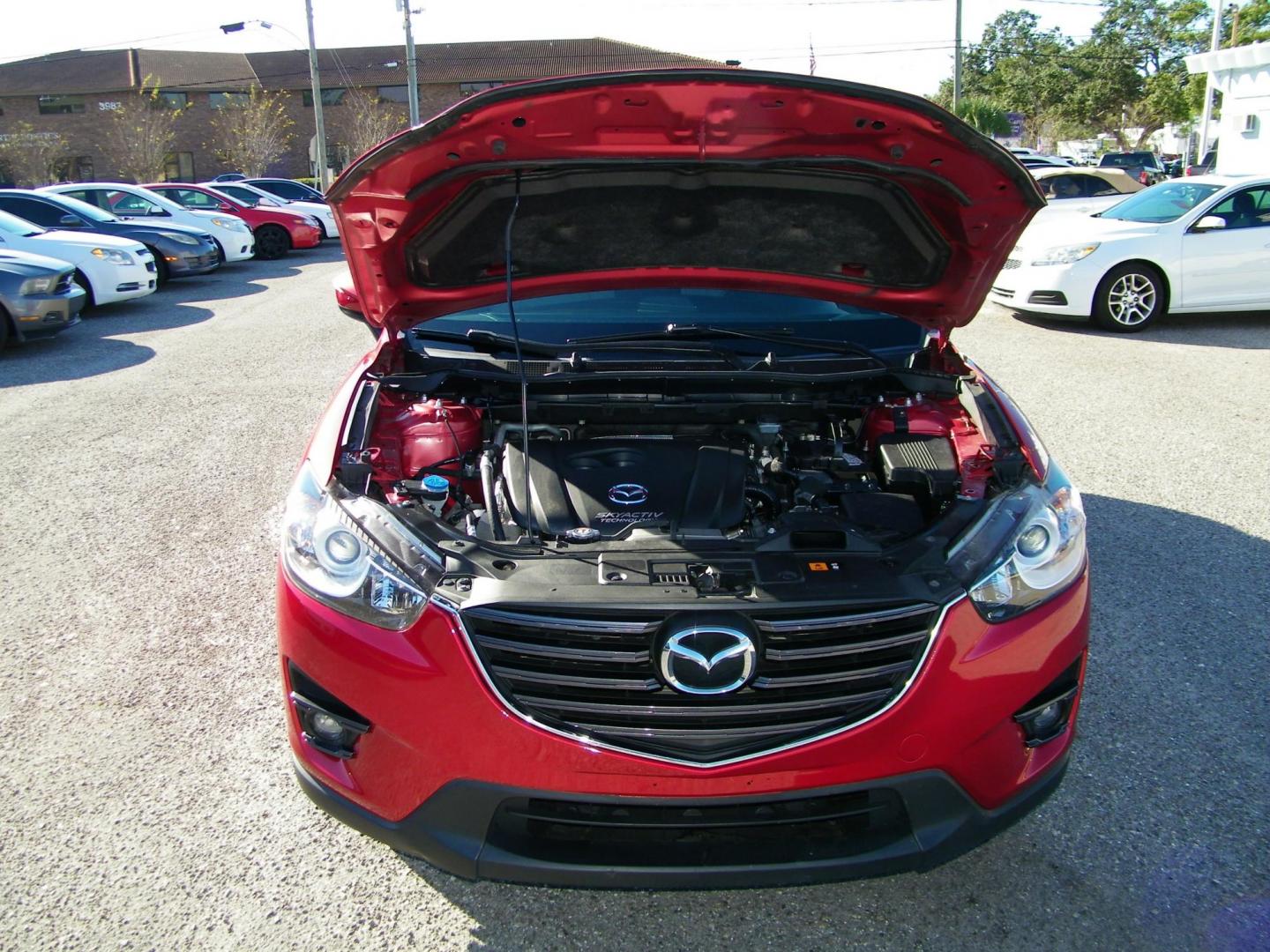 2016 Red /Beige Mazda CX-5 Touring (JM3KE2CY0G0) with an 2.5L L4 DOHC 16V engine, 6-Speed Automatic transmission, located at 4000 Bee Ridge Road, Sarasota, FL, 34233, (941) 926-0300, 27.298664, -82.489151 - Photo#8