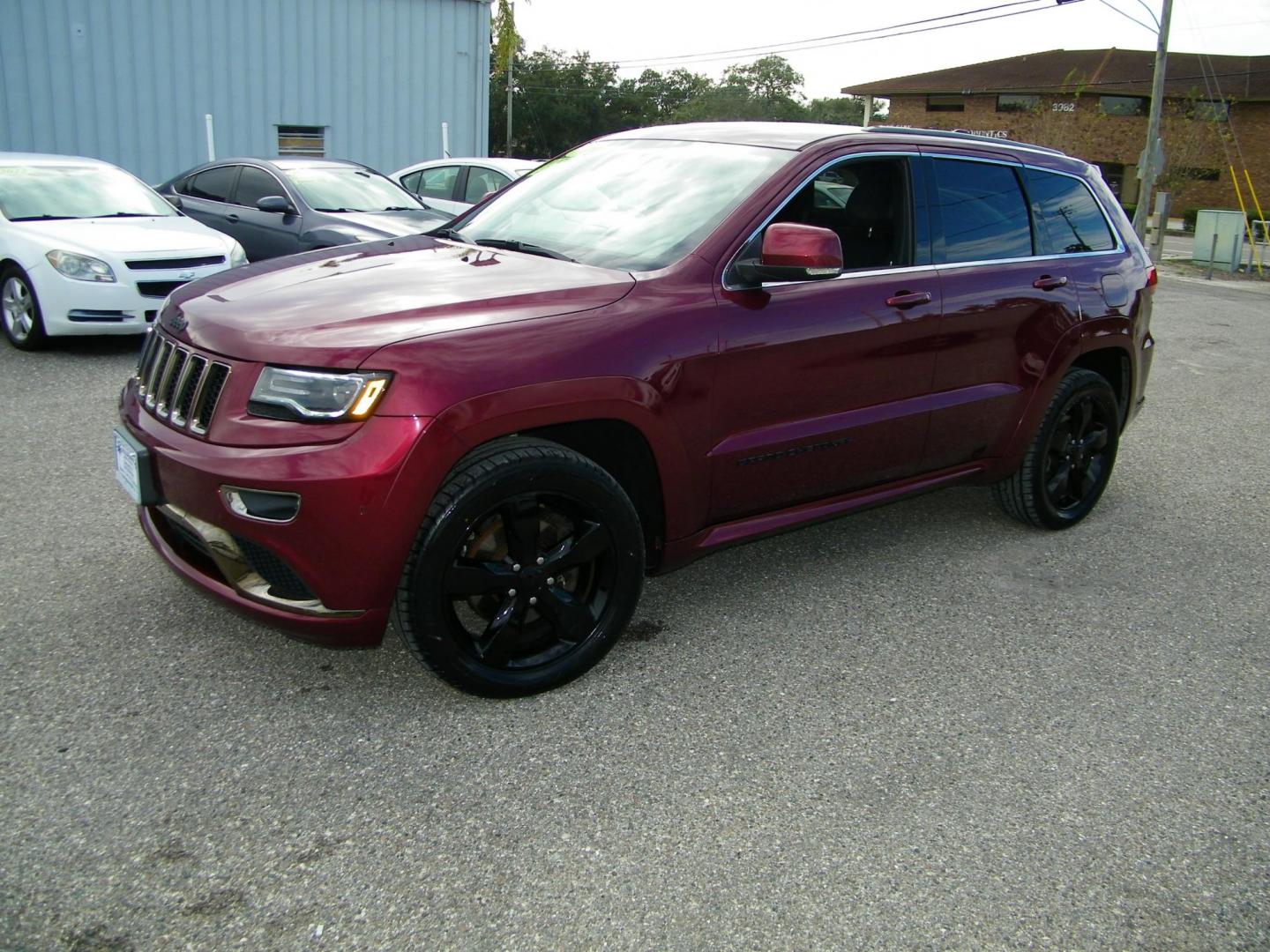 2016 Red /Black Jeep Grand Cherokee Overland 4WD (1C4RJFCG8GC) with an 3.6L V6 DOHC 24V engine, 8A transmission, located at 4000 Bee Ridge Road, Sarasota, FL, 34233, (941) 926-0300, 27.298664, -82.489151 - Photo#0