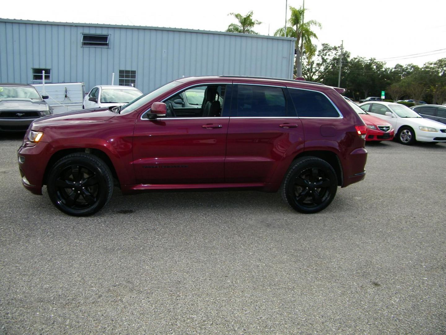 2016 Red /Black Jeep Grand Cherokee Overland 4WD (1C4RJFCG8GC) with an 3.6L V6 DOHC 24V engine, 8A transmission, located at 4000 Bee Ridge Road, Sarasota, FL, 34233, (941) 926-0300, 27.298664, -82.489151 - Photo#2