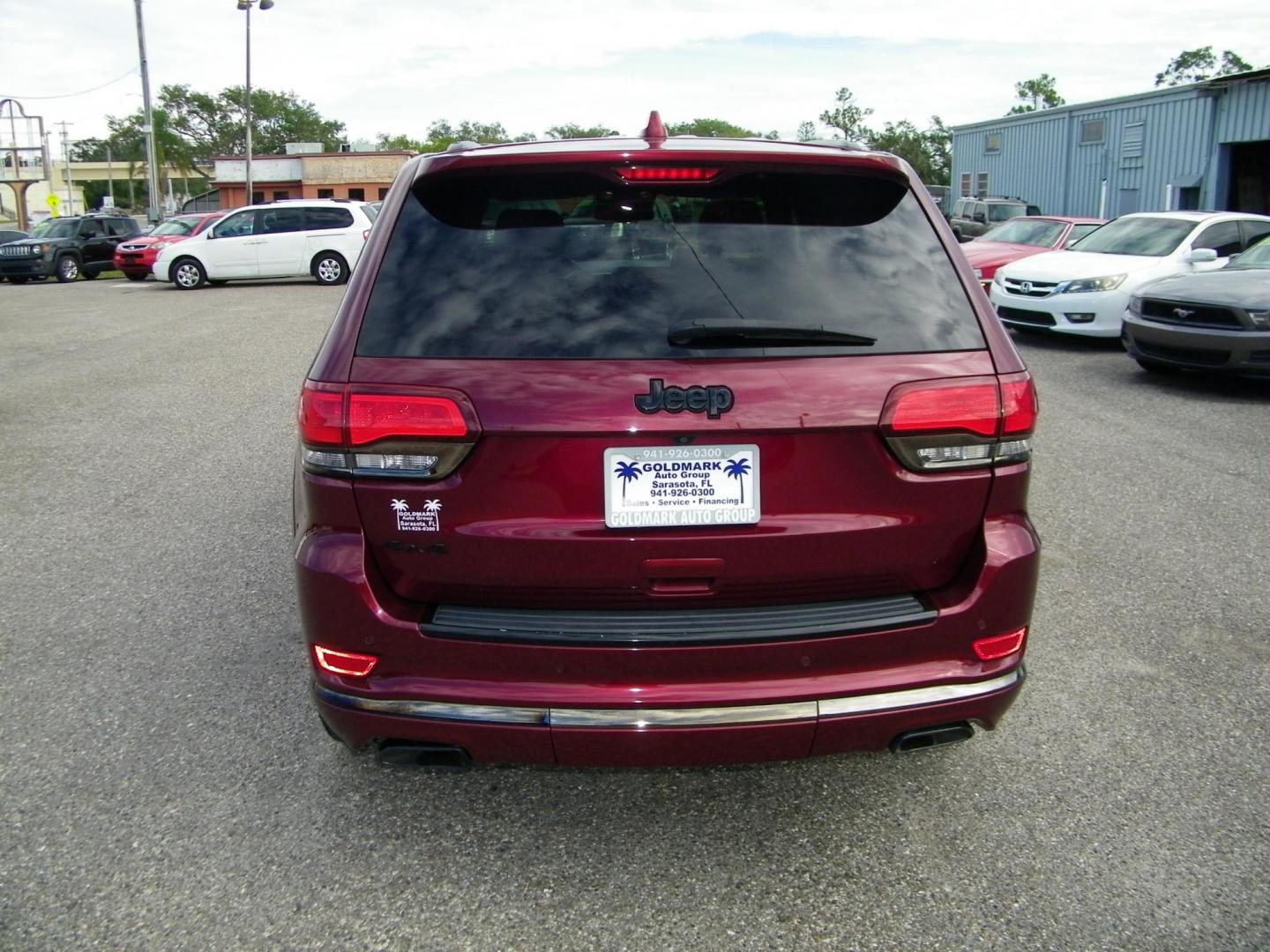 2016 Red /Black Jeep Grand Cherokee Overland 4WD (1C4RJFCG8GC) with an 3.6L V6 DOHC 24V engine, 8A transmission, located at 4000 Bee Ridge Road, Sarasota, FL, 34233, (941) 926-0300, 27.298664, -82.489151 - Photo#4