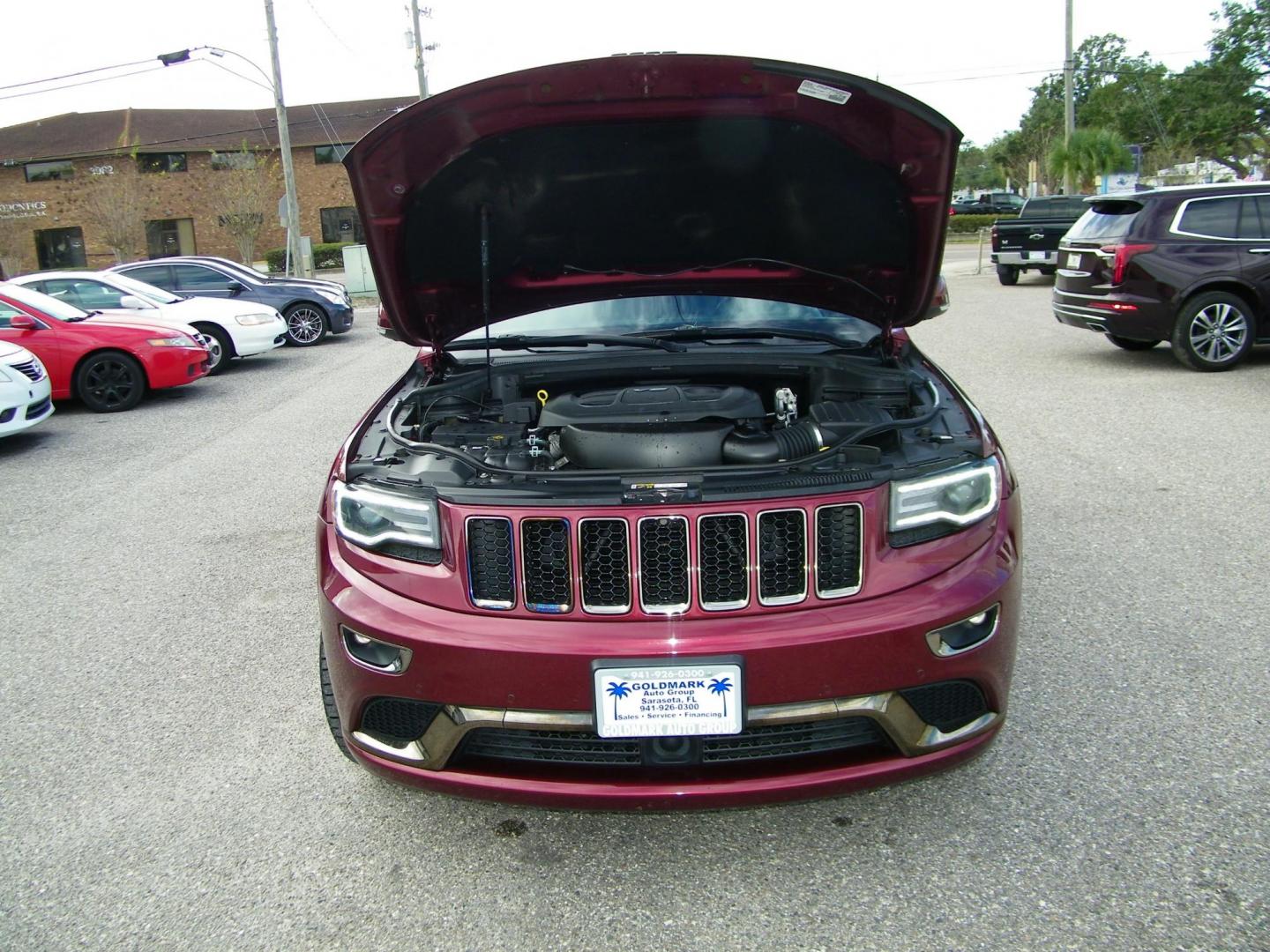 2016 Red /Black Jeep Grand Cherokee Overland 4WD (1C4RJFCG8GC) with an 3.6L V6 DOHC 24V engine, 8A transmission, located at 4000 Bee Ridge Road, Sarasota, FL, 34233, (941) 926-0300, 27.298664, -82.489151 - Photo#8
