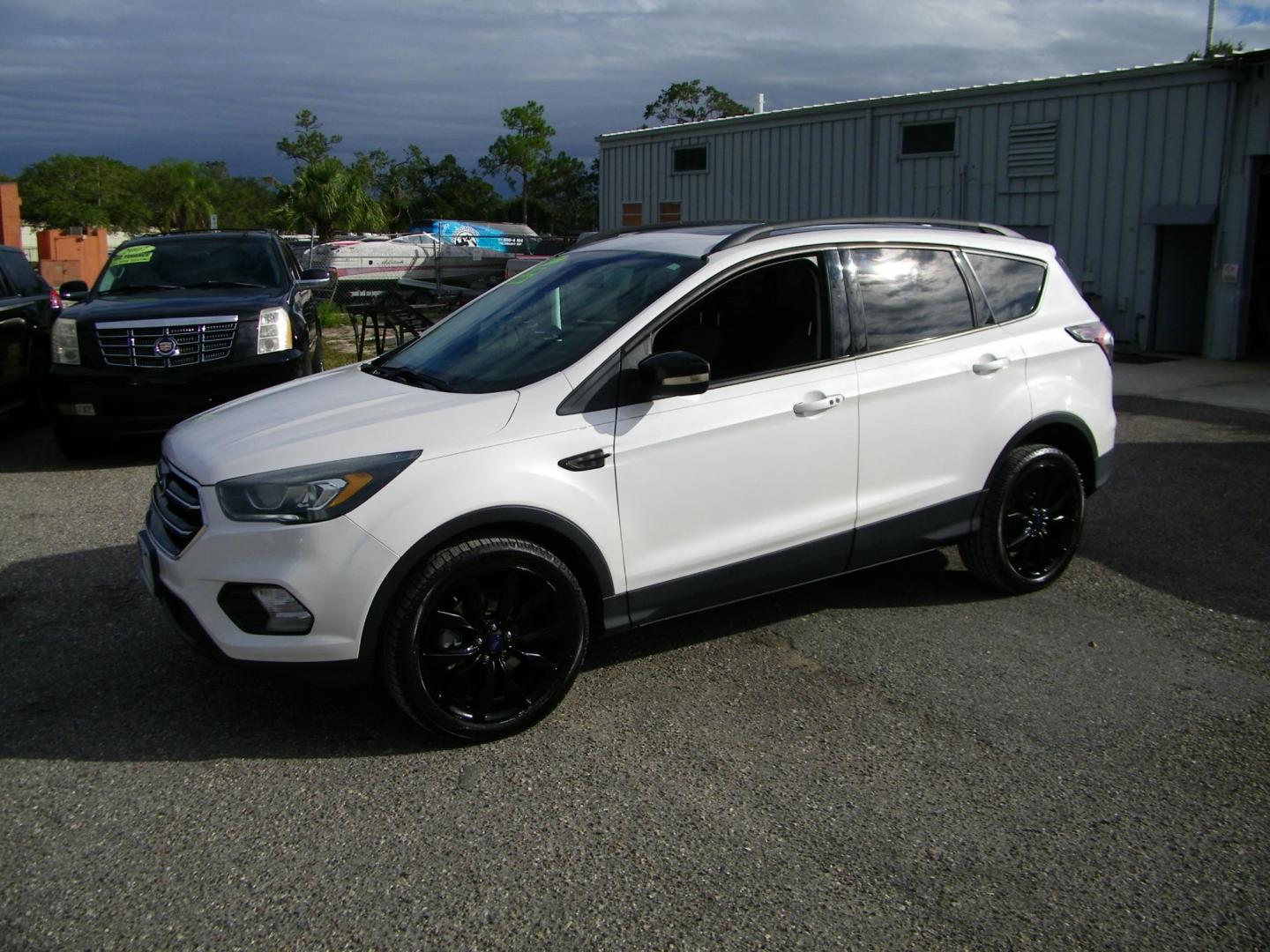 2017 WHITE /Black Ford Escape Titanium 4WD (1FMCU9J98HU) with an 2.0L L4 DOHC 16V engine, 6A transmission, located at 4000 Bee Ridge Road, Sarasota, FL, 34233, (941) 926-0300, 27.298664, -82.489151 - Photo#0
