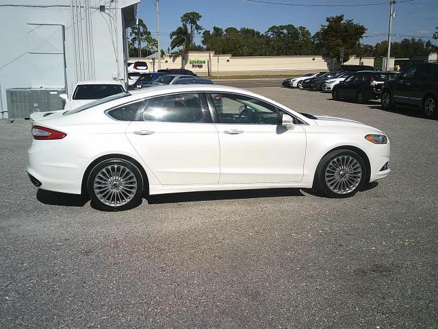 2013 WHITE /Black Ford Fusion Titanium (3FA6P0K93DR) with an 2.0L L4 DOHC 16V engine, Automatic transmission, located at 4000 Bee Ridge Road, Sarasota, FL, 34233, (941) 926-0300, 27.298664, -82.489151 - Photo#6
