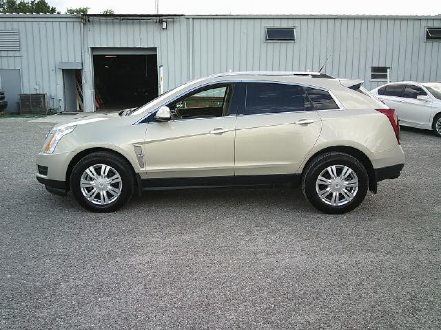 2011 Gold /Beige Cadillac SRX Luxury Collection (3GYFNAEYXBS) with an 3.0L V6 DOHC 24V engine, 6-Speed Automatic transmission, located at 4000 Bee Ridge Road, Sarasota, FL, 34233, (941) 926-0300, 27.298664, -82.489151- Photo#2