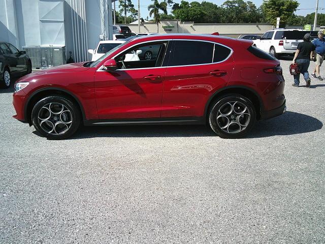 2018 Red /Black Alfa Romeo Stelvio Base (ZASFAKAN7J7) with an 2.0L L4 DOHC 16V engine, 8A transmission, located at 4000 Bee Ridge Road, Sarasota, FL, 34233, (941) 926-0300, 27.298664, -82.489151 - Photo#2