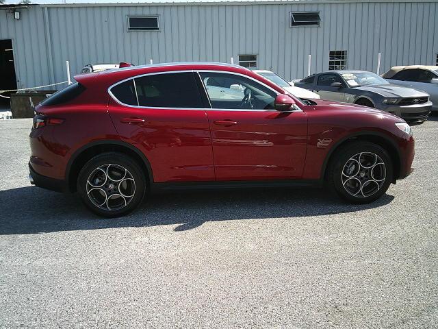 2018 Red /Black Alfa Romeo Stelvio Base (ZASFAKAN7J7) with an 2.0L L4 DOHC 16V engine, 8A transmission, located at 4000 Bee Ridge Road, Sarasota, FL, 34233, (941) 926-0300, 27.298664, -82.489151 - Photo#6