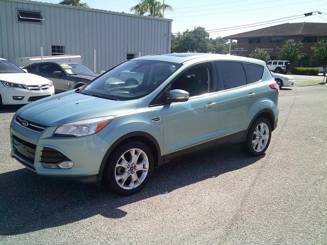 2013 Green /Black Ford Escape SEL FWD (1FMCU0HX4DU) with an 1.6L L4 DOHC 16V engine, 6A transmission, located at 4000 Bee Ridge Road, Sarasota, FL, 34233, (941) 926-0300, 27.298664, -82.489151- Photo#1