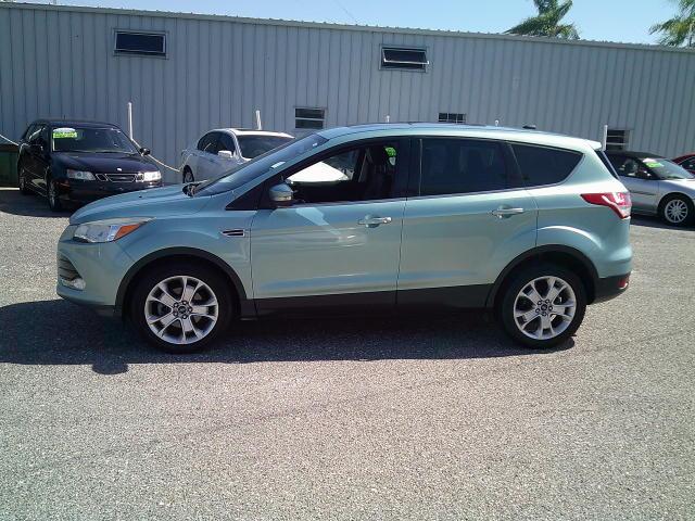 2013 Green /Black Ford Escape SEL FWD (1FMCU0HX4DU) with an 1.6L L4 DOHC 16V engine, 6A transmission, located at 4000 Bee Ridge Road, Sarasota, FL, 34233, (941) 926-0300, 27.298664, -82.489151- Photo#3