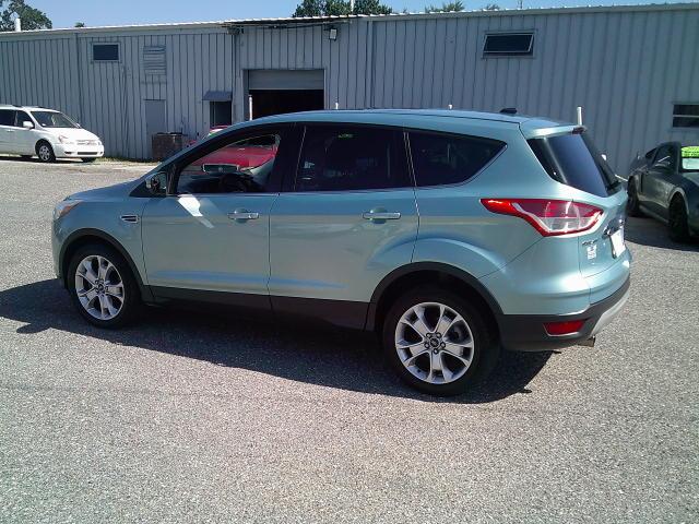 2013 Green /Black Ford Escape SEL FWD (1FMCU0HX4DU) with an 1.6L L4 DOHC 16V engine, 6A transmission, located at 4000 Bee Ridge Road, Sarasota, FL, 34233, (941) 926-0300, 27.298664, -82.489151- Photo#4