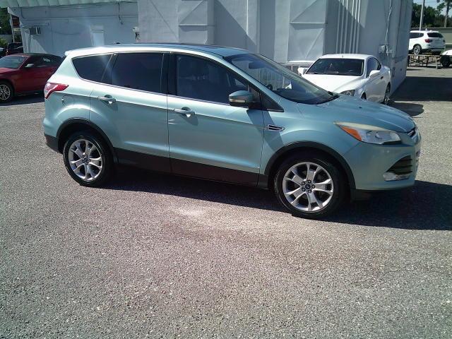 2013 Green /Black Ford Escape SEL FWD (1FMCU0HX4DU) with an 1.6L L4 DOHC 16V engine, 6A transmission, located at 4000 Bee Ridge Road, Sarasota, FL, 34233, (941) 926-0300, 27.298664, -82.489151- Photo#8