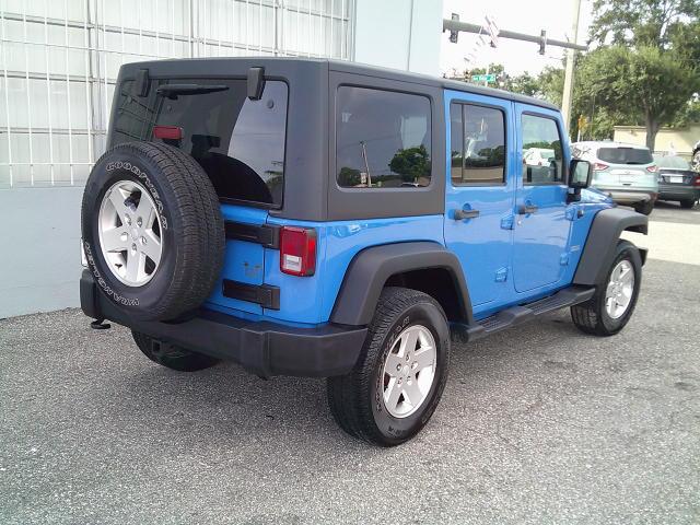 2011 Blue /Grey Jeep Wrangler Unlimited Sport 4WD (1J4HA3H10BL) with an 3.8L V6 OHV 12V engine, Automatic transmission, located at 4000 Bee Ridge Road, Sarasota, FL, 34233, (941) 926-0300, 27.298664, -82.489151- Photo#3