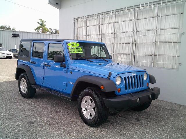 2011 Blue /Grey Jeep Wrangler Unlimited Sport 4WD (1J4HA3H10BL) with an 3.8L V6 OHV 12V engine, Automatic transmission, located at 4000 Bee Ridge Road, Sarasota, FL, 34233, (941) 926-0300, 27.298664, -82.489151- Photo#1