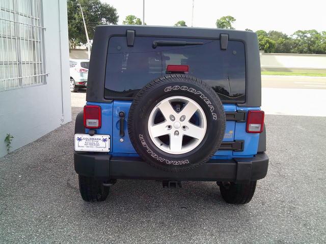 2011 Blue /Grey Jeep Wrangler Unlimited Sport 4WD (1J4HA3H10BL) with an 3.8L V6 OHV 12V engine, Automatic transmission, located at 4000 Bee Ridge Road, Sarasota, FL, 34233, (941) 926-0300, 27.298664, -82.489151- Photo#5