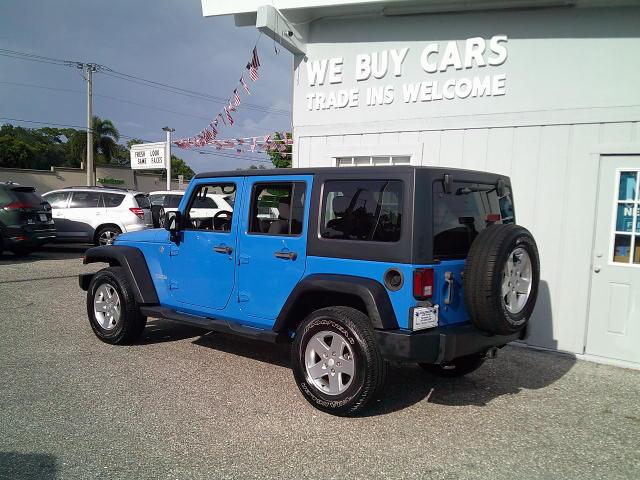 2011 Blue /Grey Jeep Wrangler Unlimited Sport 4WD (1J4HA3H10BL) with an 3.8L V6 OHV 12V engine, Automatic transmission, located at 4000 Bee Ridge Road, Sarasota, FL, 34233, (941) 926-0300, 27.298664, -82.489151- Photo#4