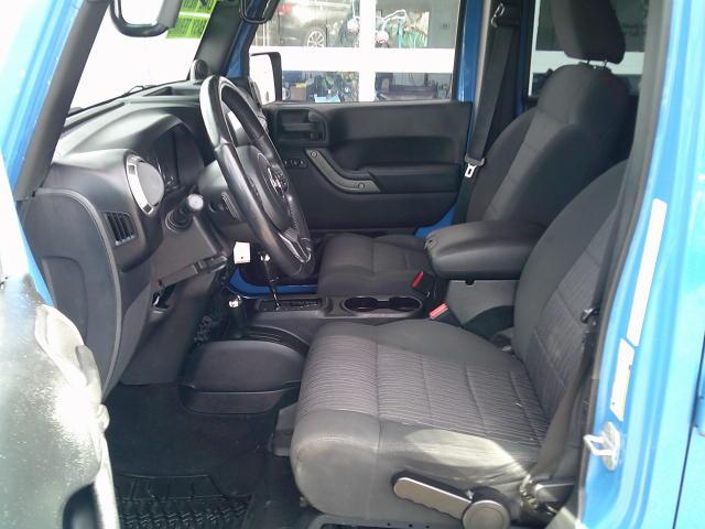 2011 Blue /Grey Jeep Wrangler Unlimited Sport 4WD (1J4HA3H10BL) with an 3.8L V6 OHV 12V engine, Automatic transmission, located at 4000 Bee Ridge Road, Sarasota, FL, 34233, (941) 926-0300, 27.298664, -82.489151- Photo#9