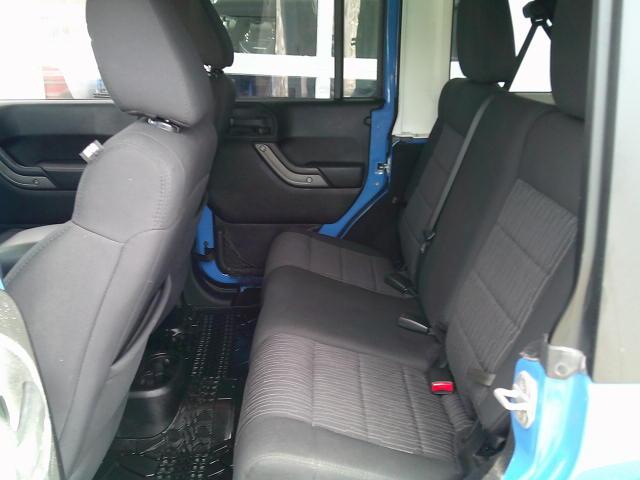2011 Blue /Grey Jeep Wrangler Unlimited Sport 4WD (1J4HA3H10BL) with an 3.8L V6 OHV 12V engine, Automatic transmission, located at 4000 Bee Ridge Road, Sarasota, FL, 34233, (941) 926-0300, 27.298664, -82.489151- Photo#10