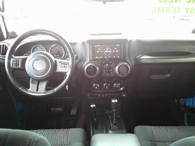 2011 Blue /Grey Jeep Wrangler Unlimited Sport 4WD (1J4HA3H10BL) with an 3.8L V6 OHV 12V engine, Automatic transmission, located at 4000 Bee Ridge Road, Sarasota, FL, 34233, (941) 926-0300, 27.298664, -82.489151- Photo#11