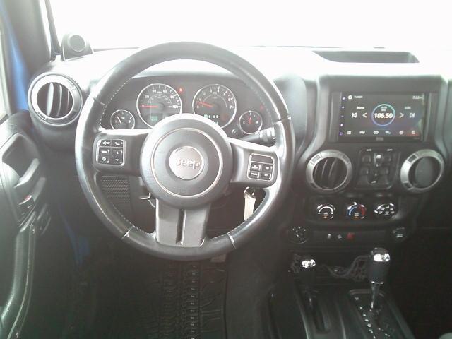 2011 Blue /Grey Jeep Wrangler Unlimited Sport 4WD (1J4HA3H10BL) with an 3.8L V6 OHV 12V engine, Automatic transmission, located at 4000 Bee Ridge Road, Sarasota, FL, 34233, (941) 926-0300, 27.298664, -82.489151- Photo#12