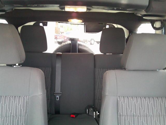 2011 Blue /Grey Jeep Wrangler Unlimited Sport 4WD (1J4HA3H10BL) with an 3.8L V6 OHV 12V engine, Automatic transmission, located at 4000 Bee Ridge Road, Sarasota, FL, 34233, (941) 926-0300, 27.298664, -82.489151- Photo#15