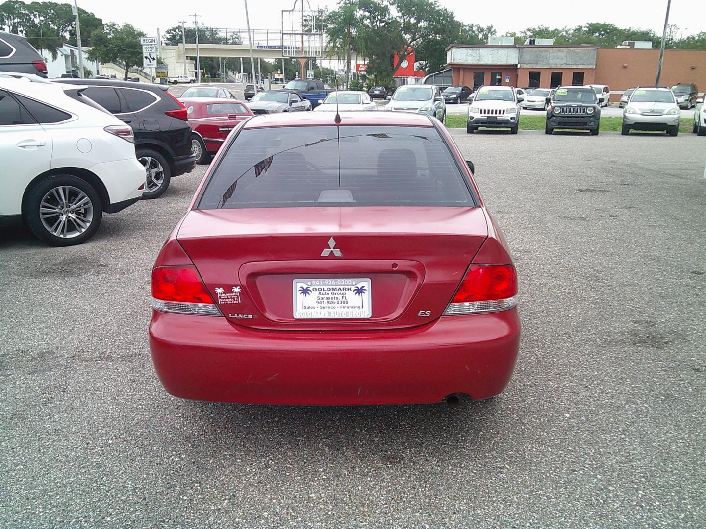 2006 Red /Gray Mitsubishi Lancer ES (JA3AJ26E36U) with an 2.0L L4 SOHC 16V engine, Automatic transmission, located at 4000 Bee Ridge Road, Sarasota, FL, 34233, (941) 926-0300, 27.298664, -82.489151- Photo#3