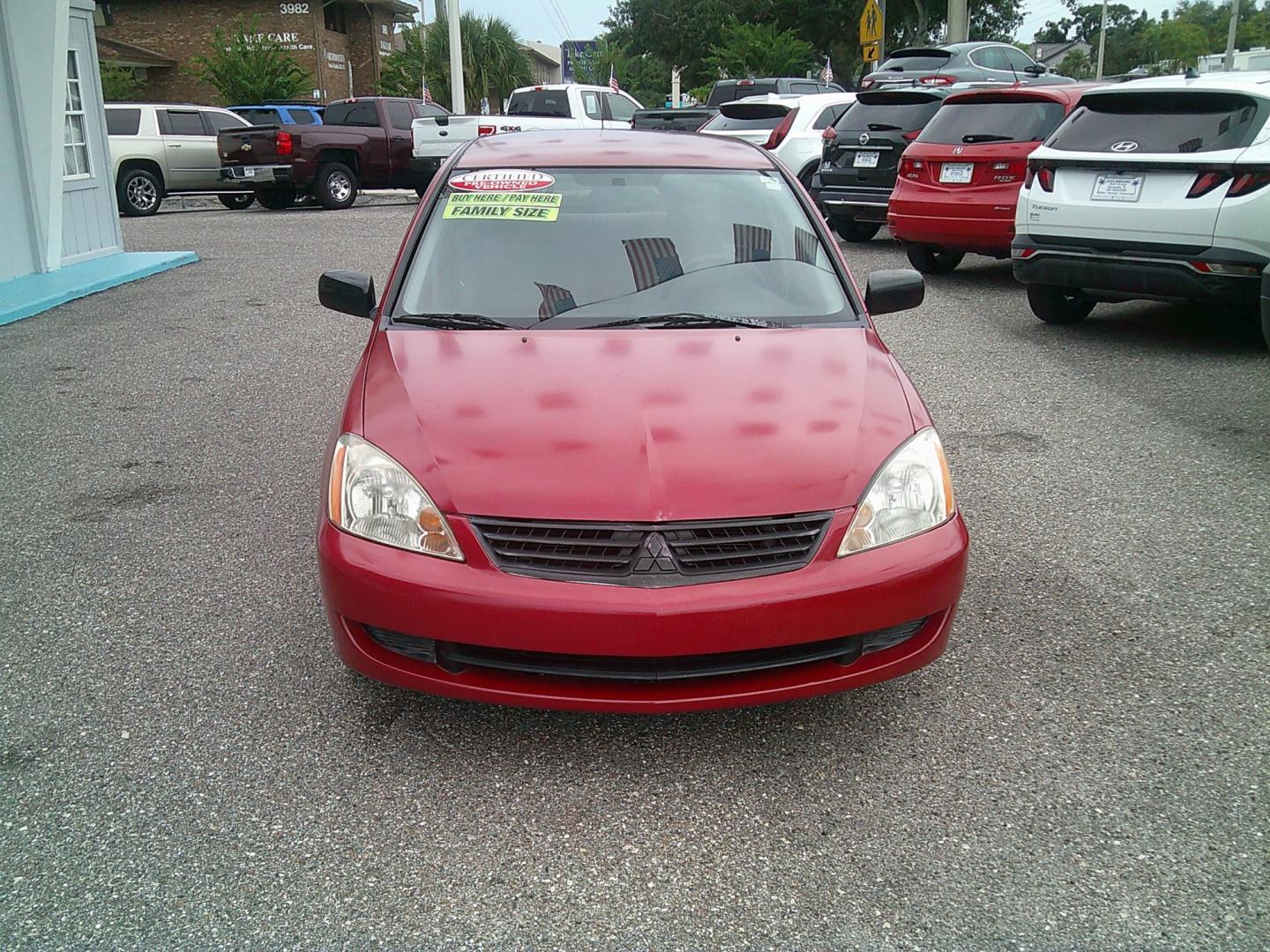 2006 Red /Gray Mitsubishi Lancer ES (JA3AJ26E36U) with an 2.0L L4 SOHC 16V engine, Automatic transmission, located at 4000 Bee Ridge Road, Sarasota, FL, 34233, (941) 926-0300, 27.298664, -82.489151- Photo#2