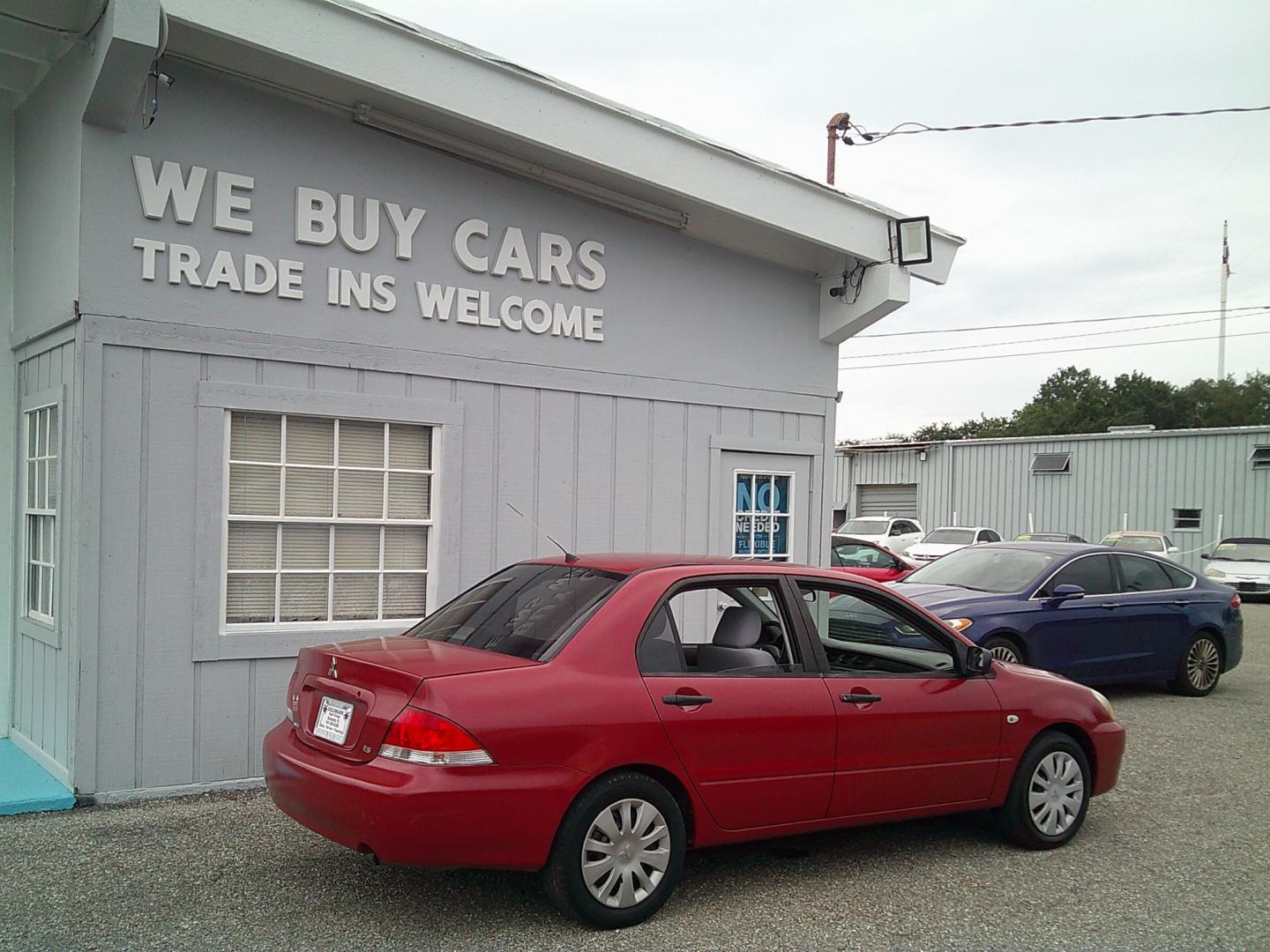 2006 Red /Gray Mitsubishi Lancer ES (JA3AJ26E36U) with an 2.0L L4 SOHC 16V engine, Automatic transmission, located at 4000 Bee Ridge Road, Sarasota, FL, 34233, (941) 926-0300, 27.298664, -82.489151- Photo#5