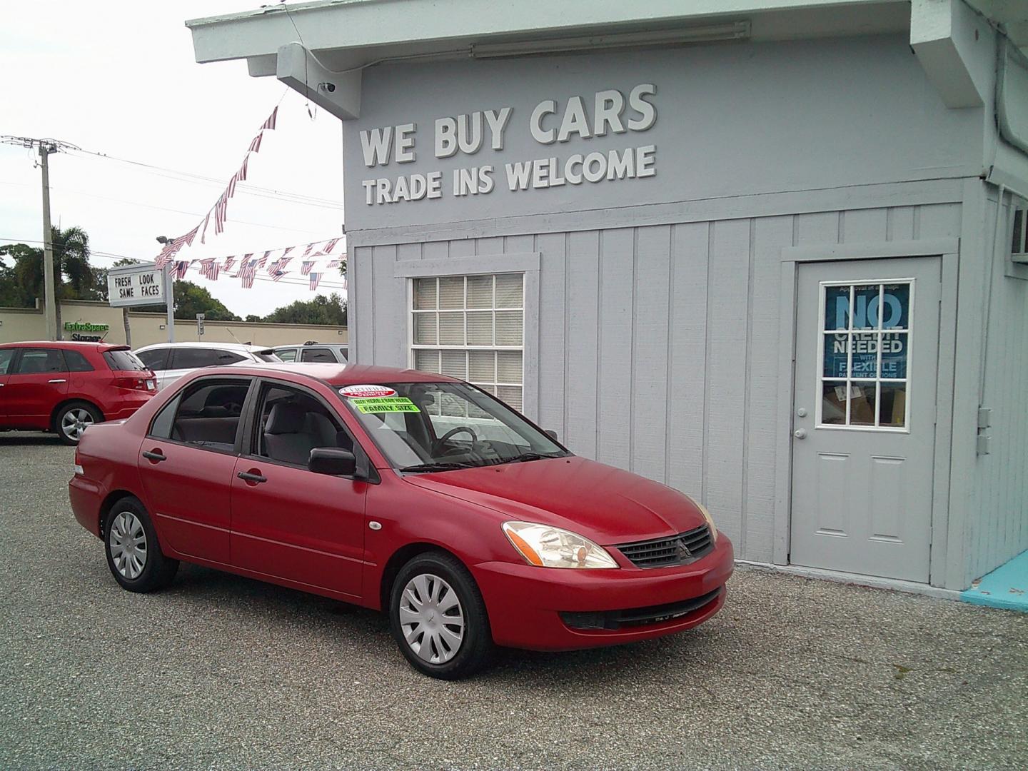 2006 Red /Gray Mitsubishi Lancer ES (JA3AJ26E36U) with an 2.0L L4 SOHC 16V engine, Automatic transmission, located at 4000 Bee Ridge Road, Sarasota, FL, 34233, (941) 926-0300, 27.298664, -82.489151- Photo#6